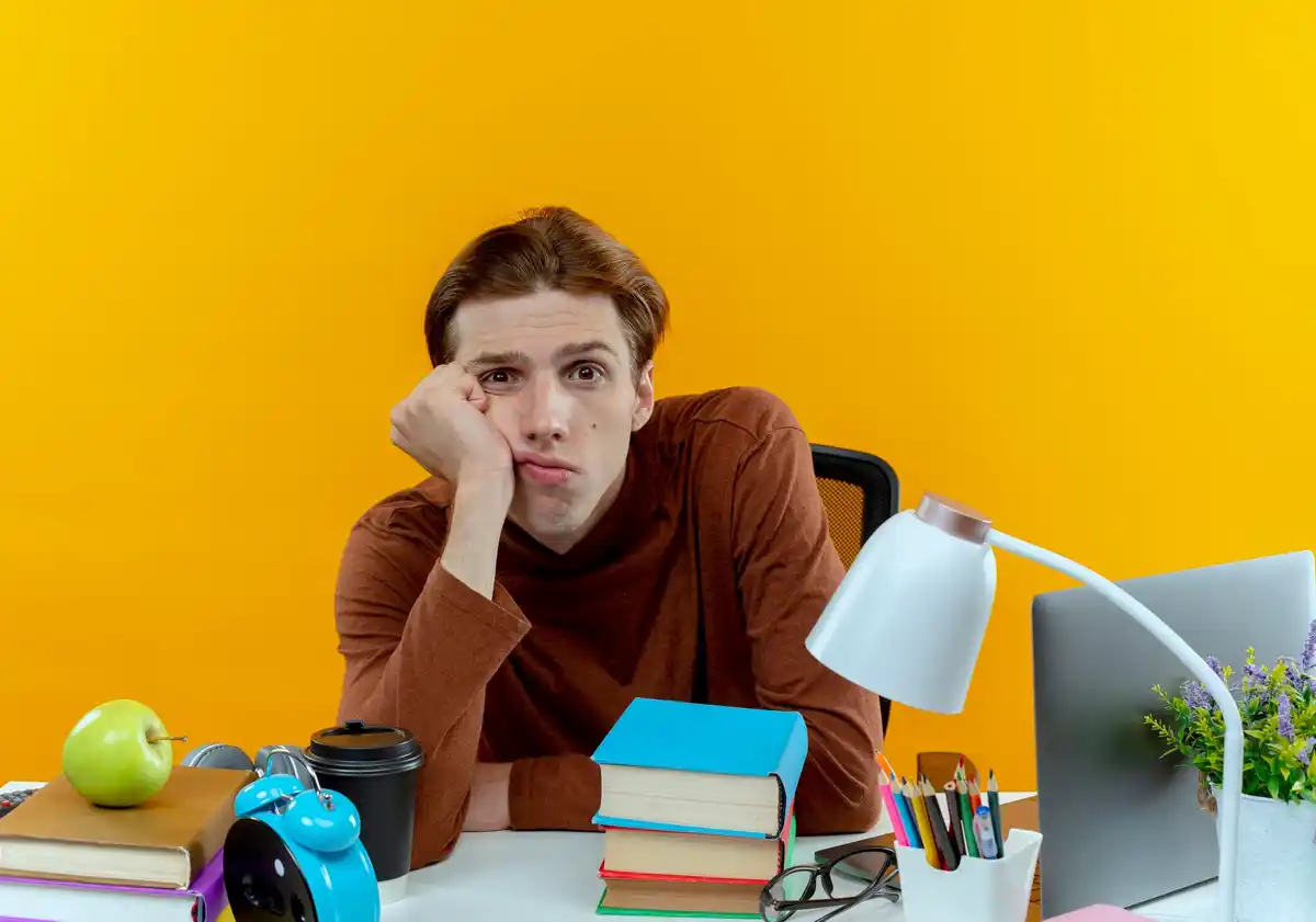 student tired late night coffee desk Netherlands
