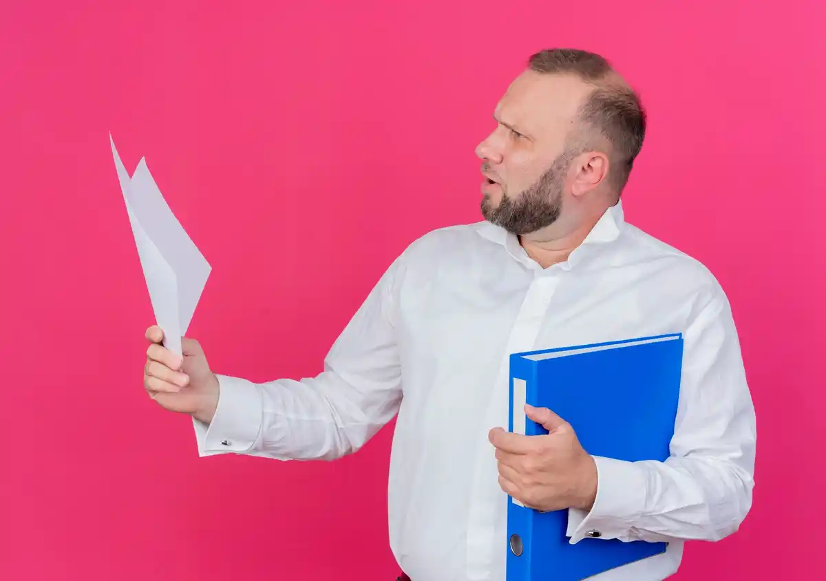 dutch business person throwing away to-do list
