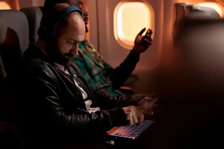 airplane overhead air vent passenger using