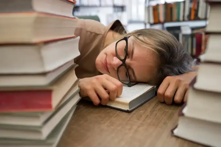 burned out student studying in dutch library