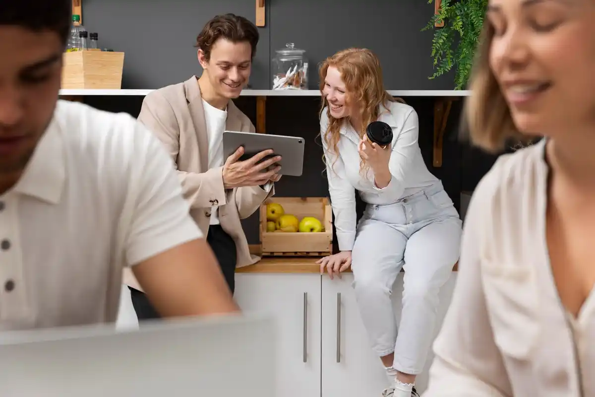 colleagues discussing phone habits in dutch office