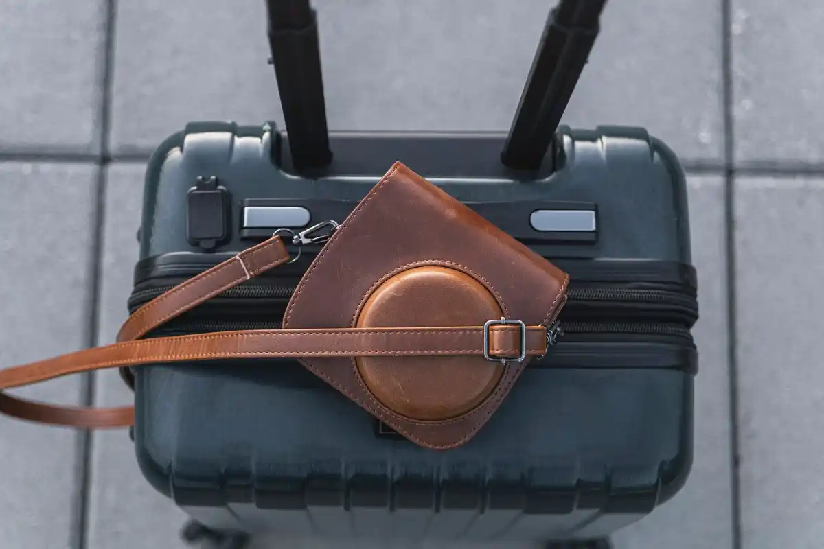 Apple AirTag in suitcase, luggage tracking, airport security