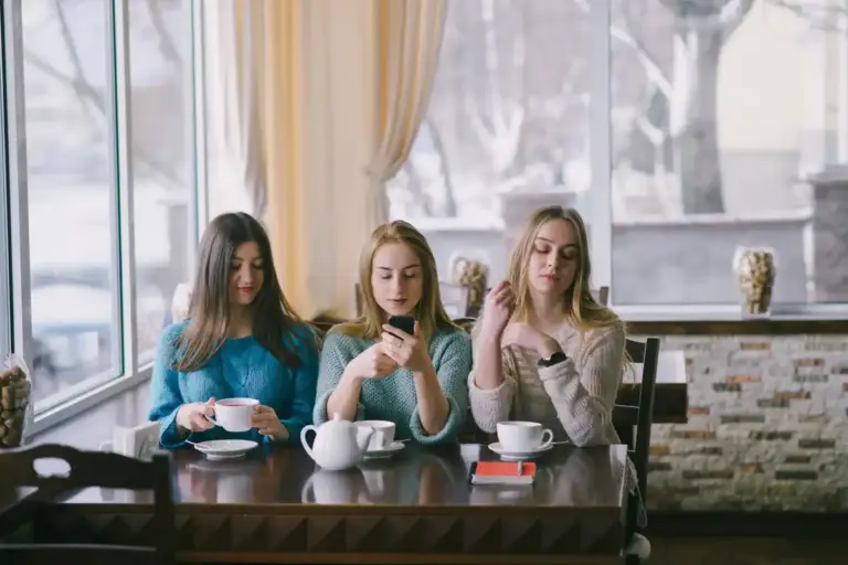 group of adults talking in Dutch café without phones