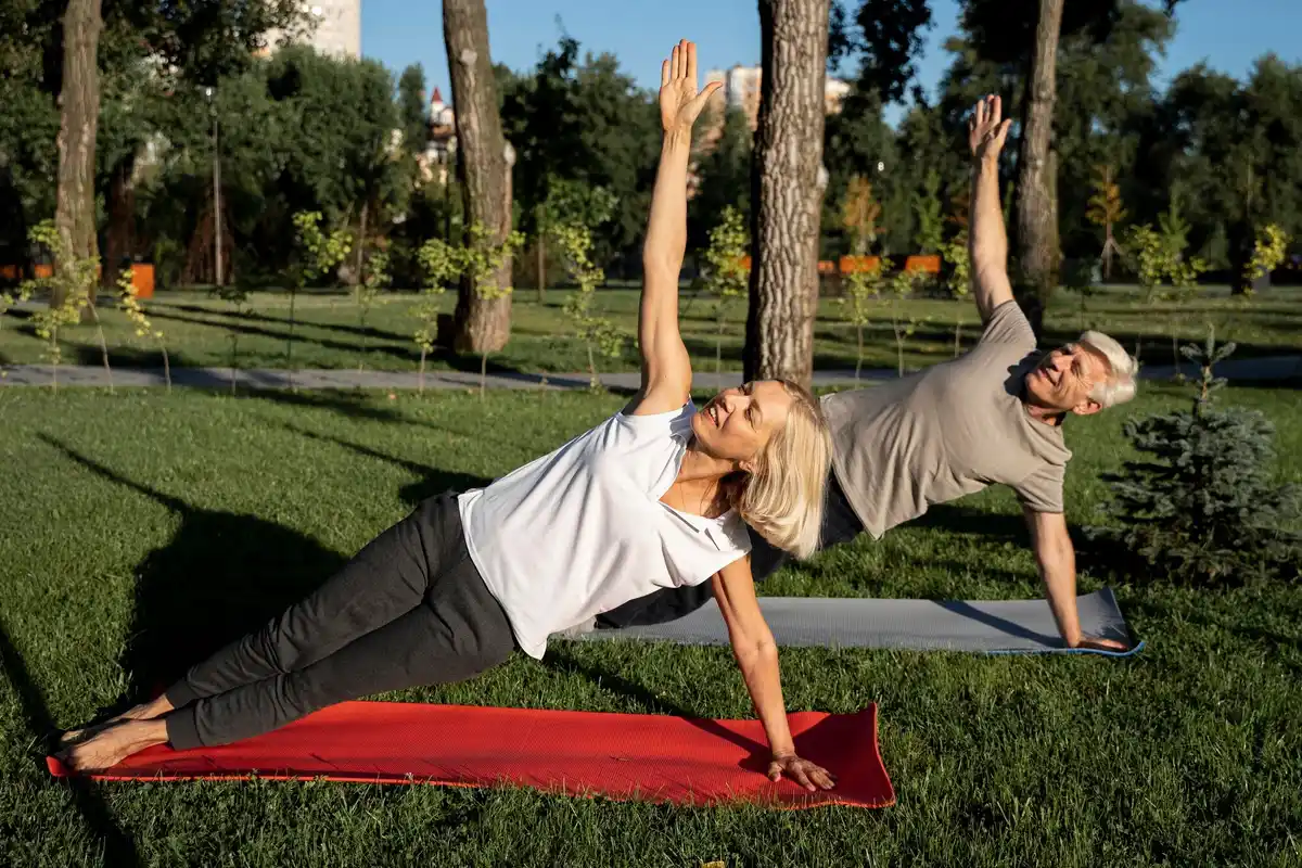 middle aged men and women exercising together outdoors netherlands
