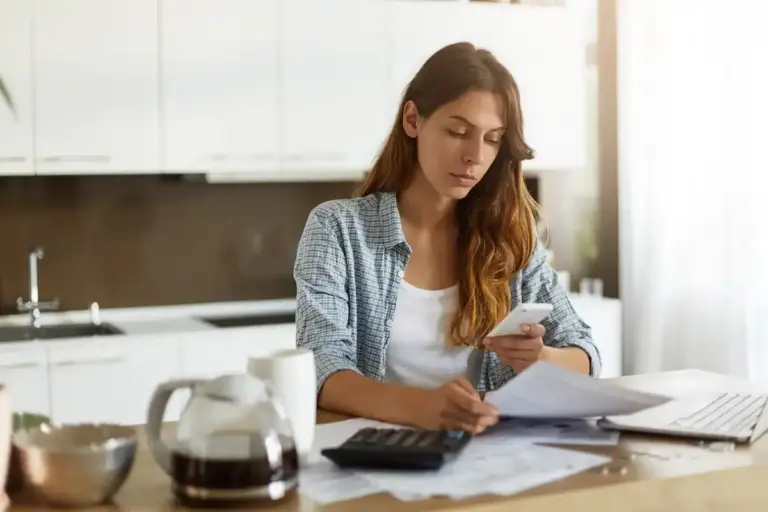 stack of Dutch receipts with calculator home office