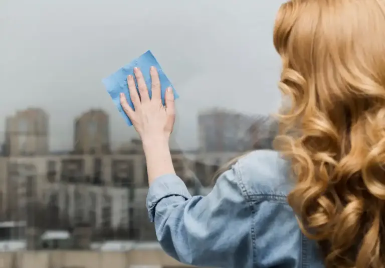 dutch window cleaning close up with newspaper