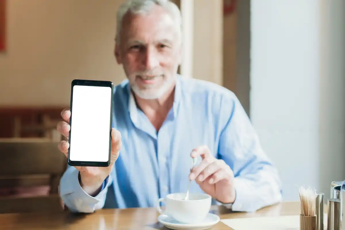 elderly person adjusting smartphone settings
