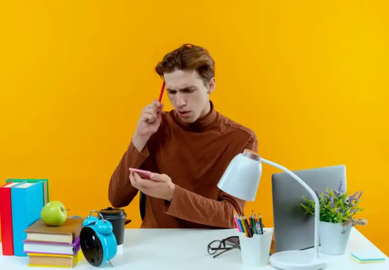 student multitasking studying laptop phone distractions