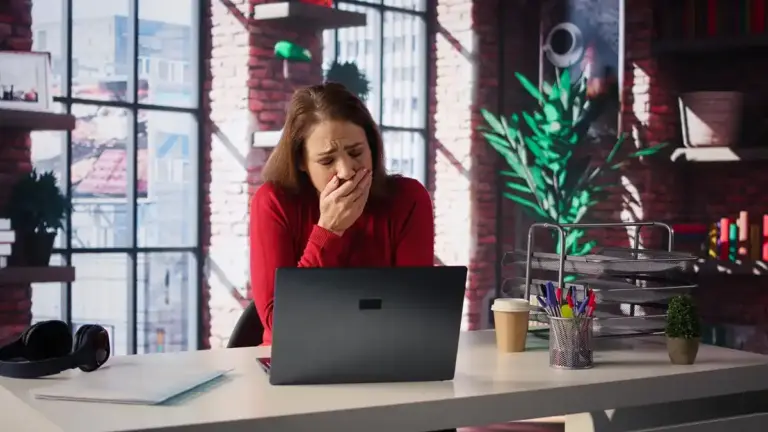 young adult stressed multitasking at computer dutch office background