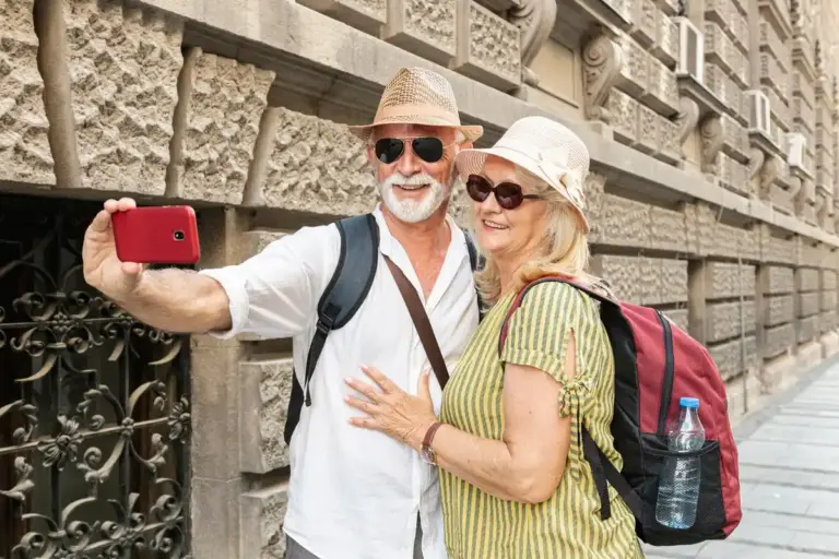 senior couple traveling europe smiling city