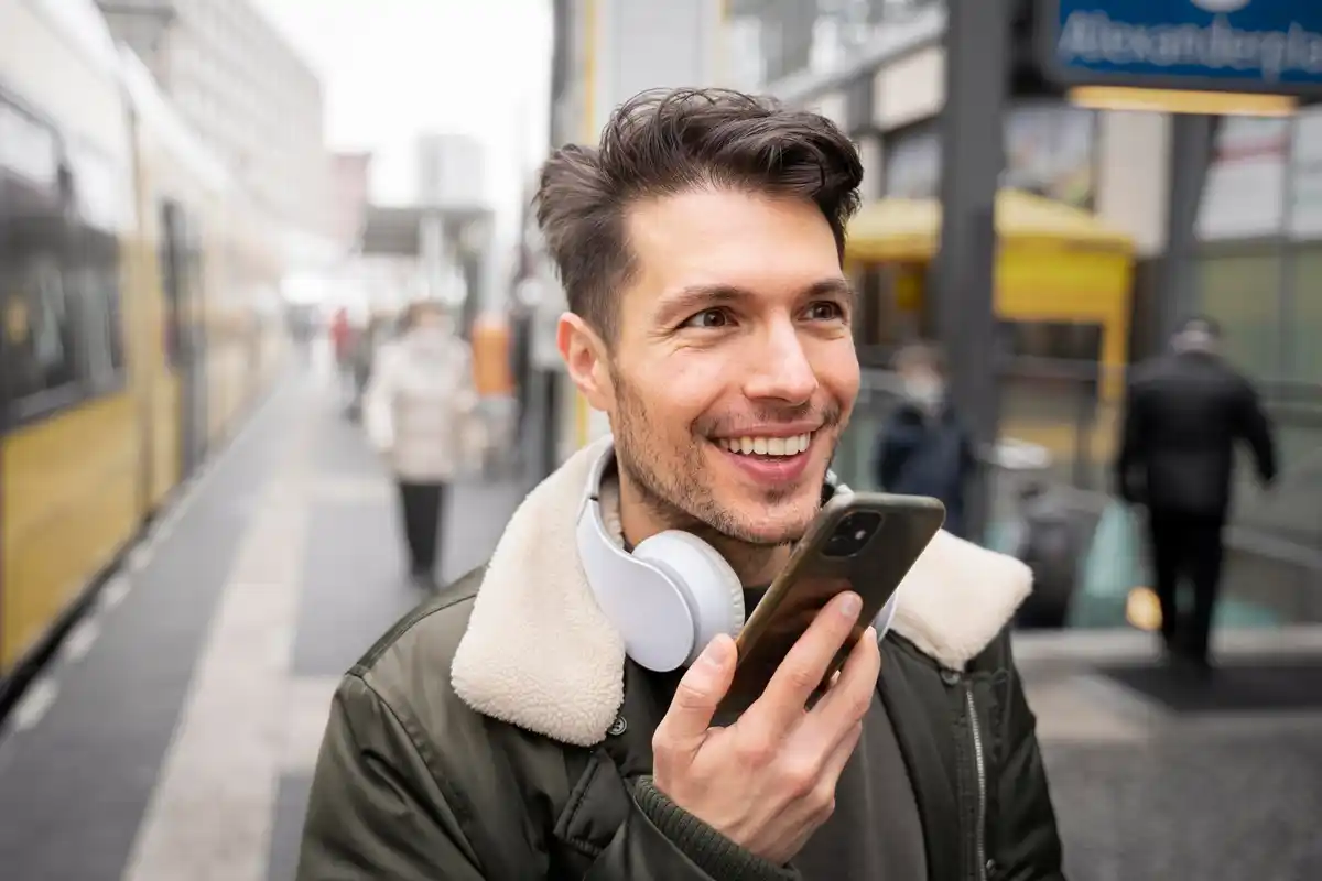 dutch person taking smartphone photo in amsterdam street
