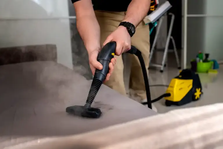 hotel housekeeper cleaning stain carpet bed