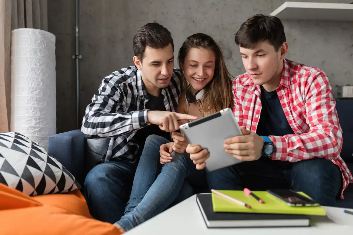 young dutch family looking at bills together living room