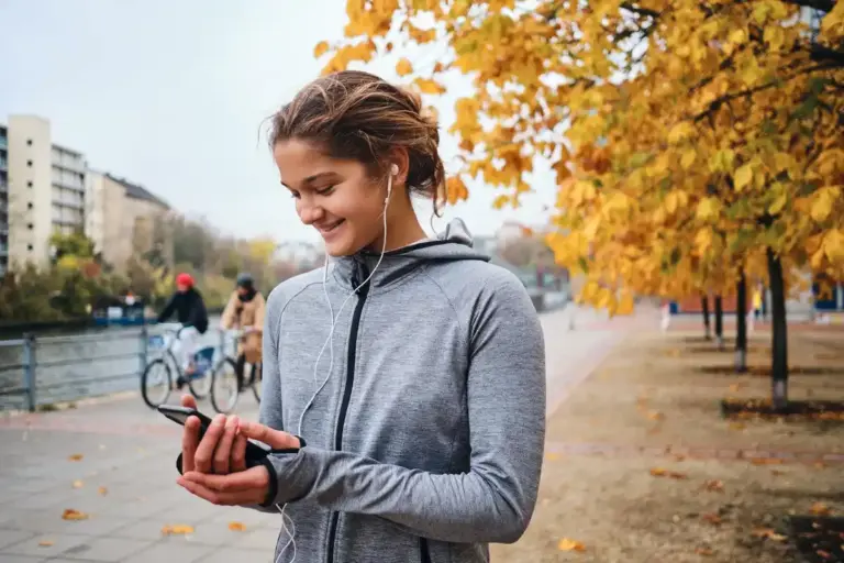 dutch person using phone for health tracking outdoors