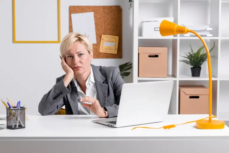 stressed office worker multitasking at desk dutch office