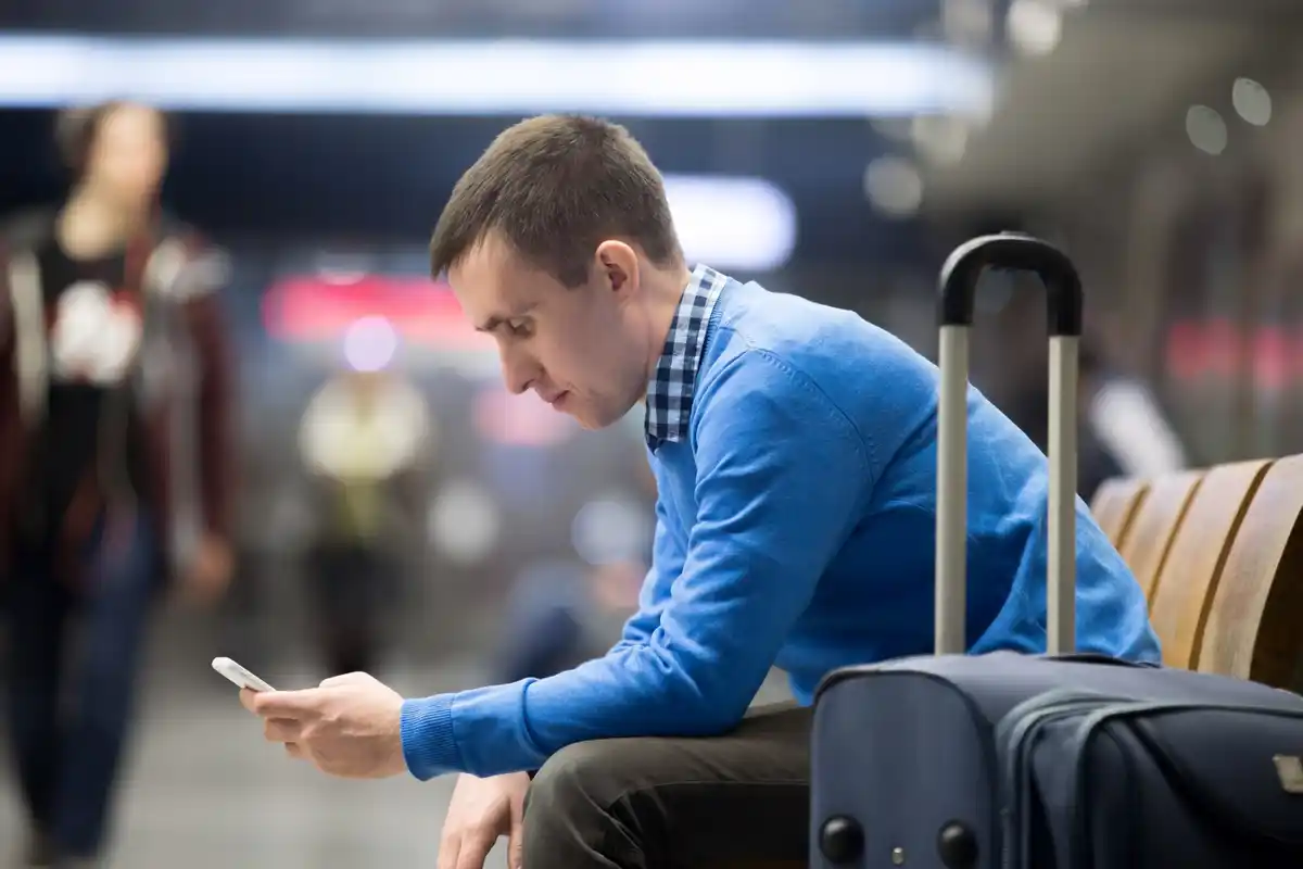 flight attendant warning passenger not to open luggage during taxi