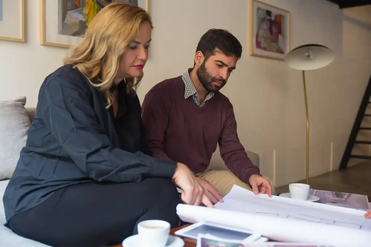 Dutch homeowner reviewing mortgage documents at home