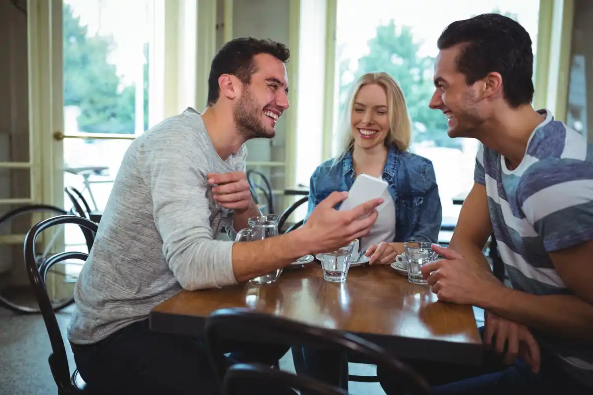 people laughing and talking at Dutch social event