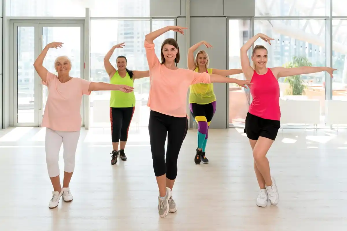happy older woman taking dance class Netherlands