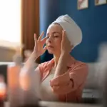 korean woman facial massage natural light home routine