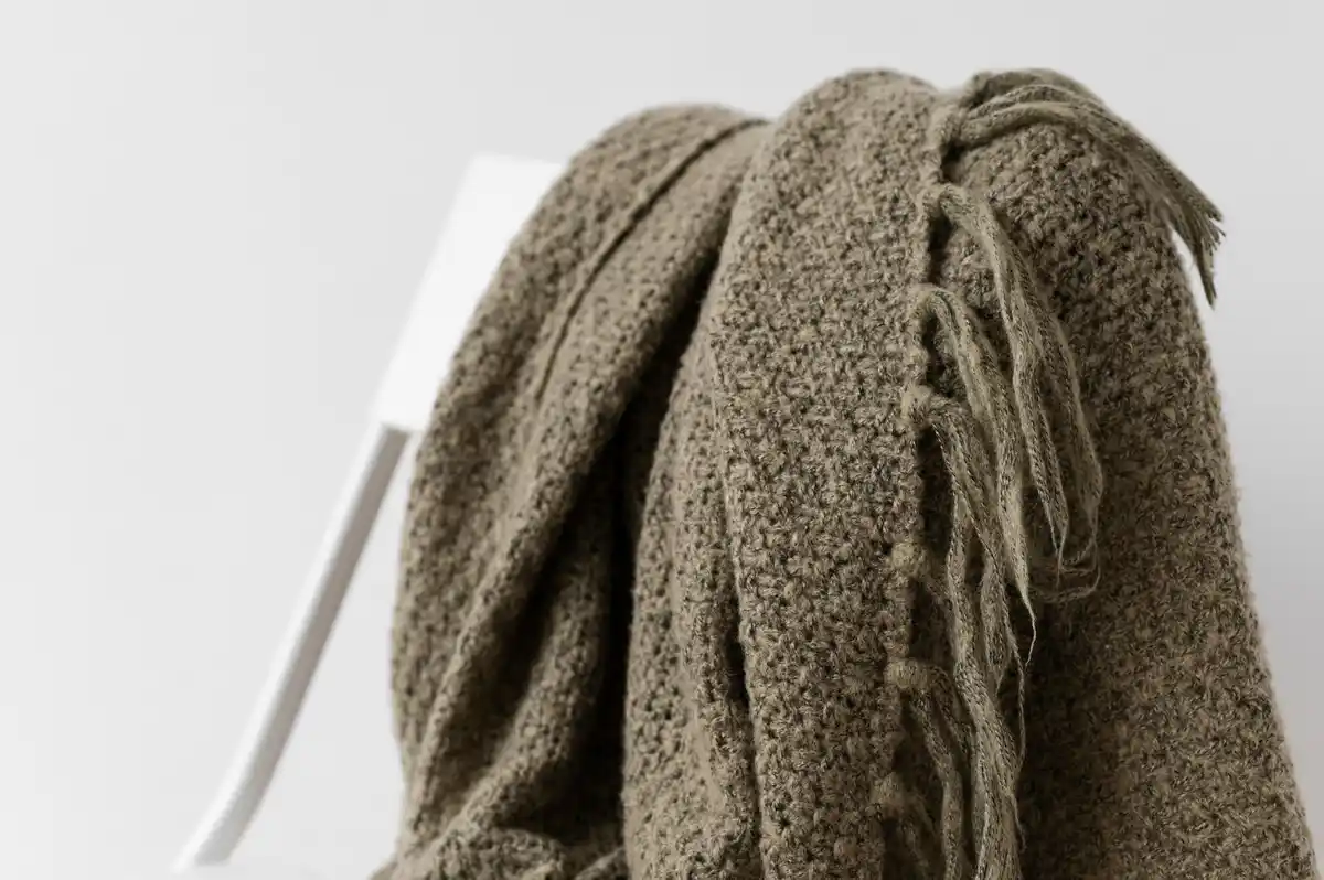ruined sweater in washing machine close up