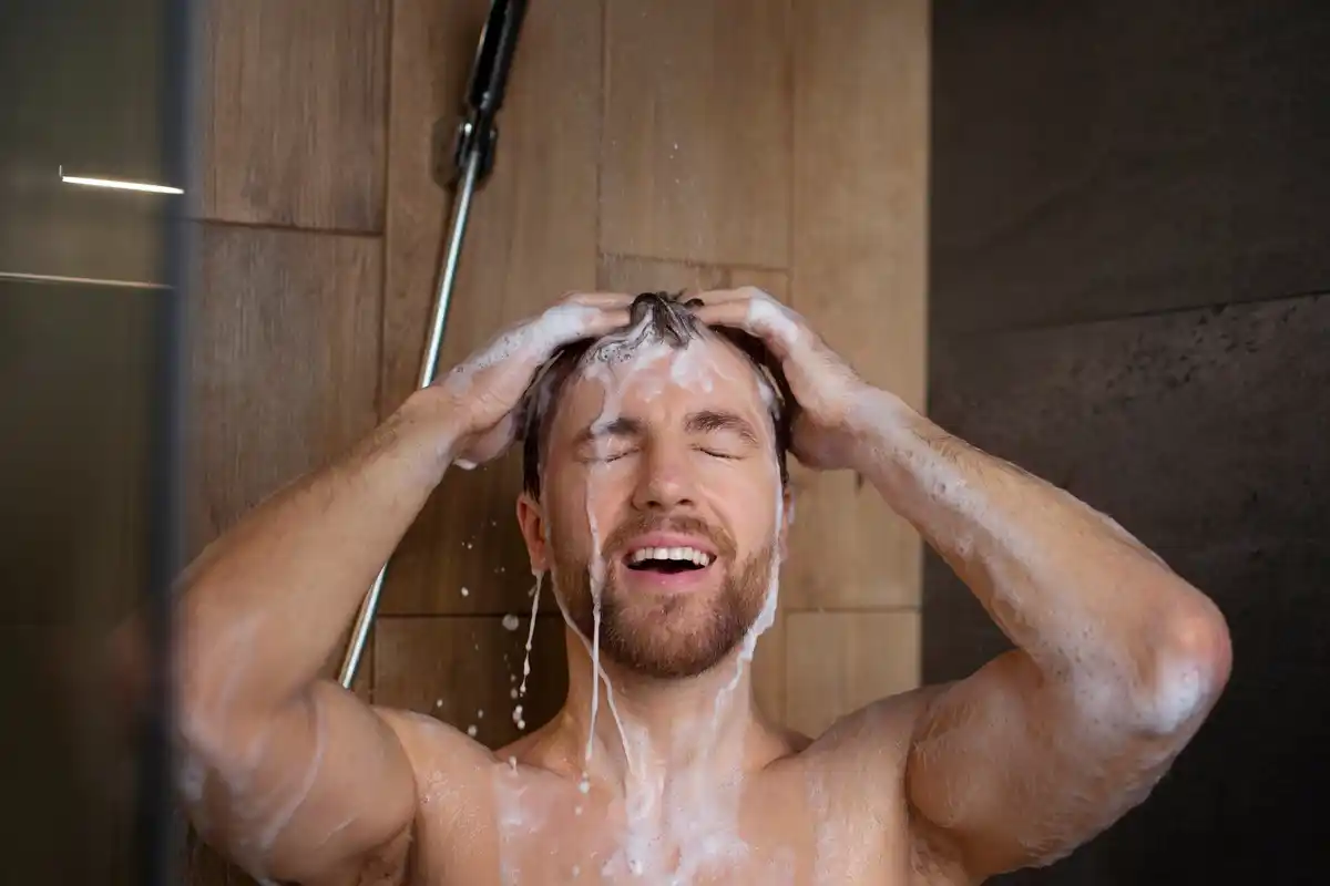 man taking cold shower energy Dutch home
