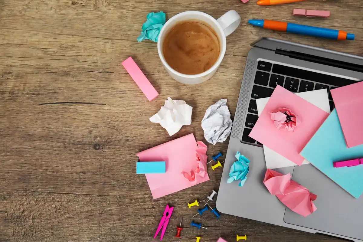 cluttered desk highlighting one distracting object