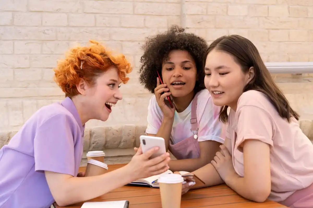 Dutch teens revising for exams together with TikTok, smartphone and notes