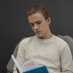 student using mirror to study alone