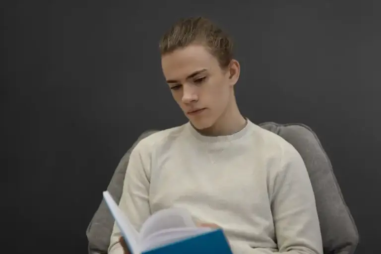 student using mirror to study alone