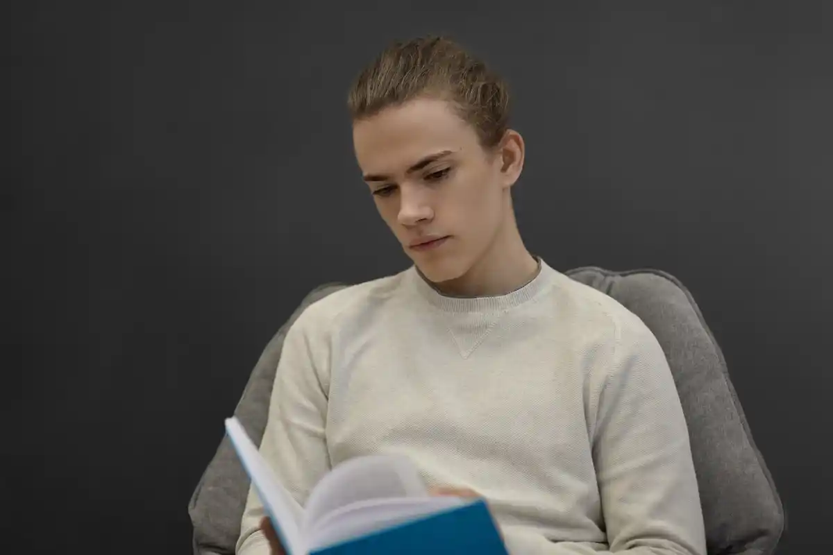 student using mirror to study alone