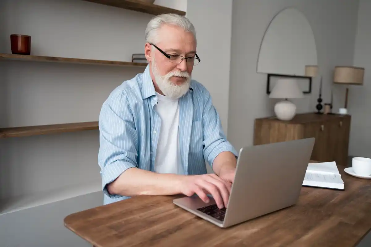 dutch retirement age man using cleaning gadgets in home