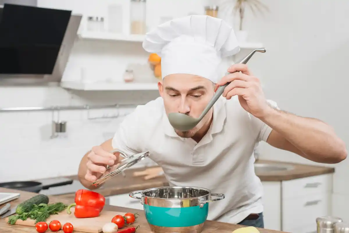kitchen chef tasting soup smelling disappointed spice