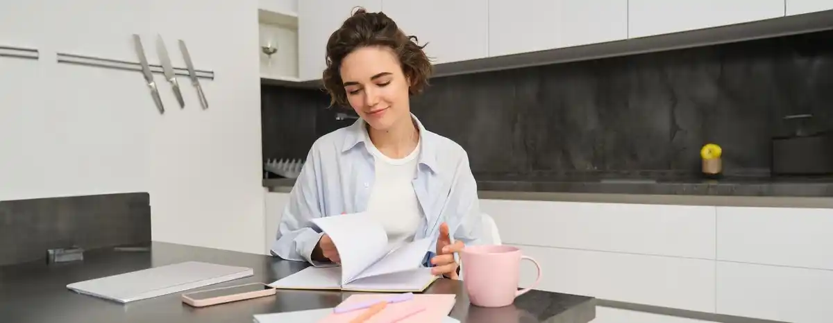 dutch woman calculates budget with envelope method at home