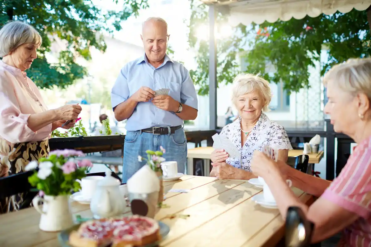 senior dutch travelers relaxing in evening european cafe