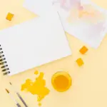 bright yellow notebook on minimalist Dutch office desk