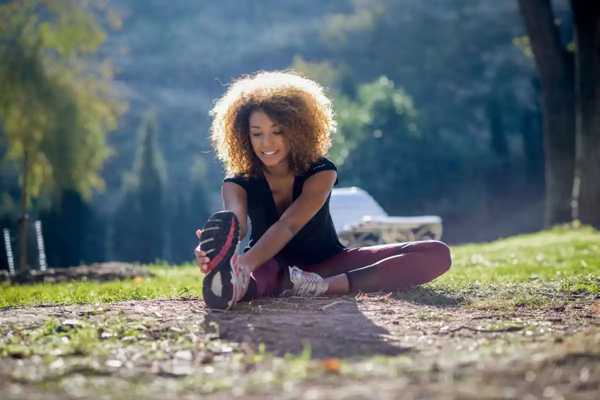 Dutch athlete stretching before workout outdoors