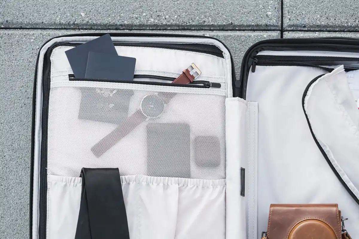 minimalist packing suitcase neatly organized
