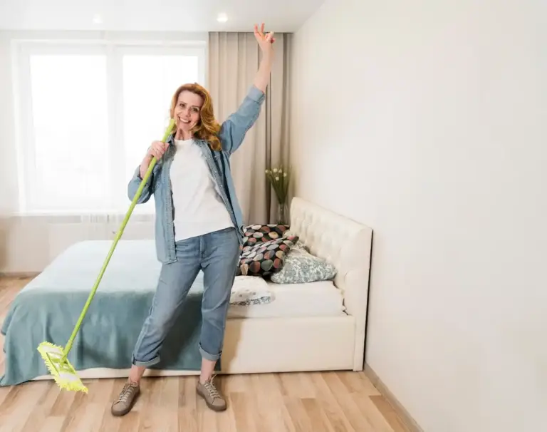 Dutch senior cleaning bedroom dust mites