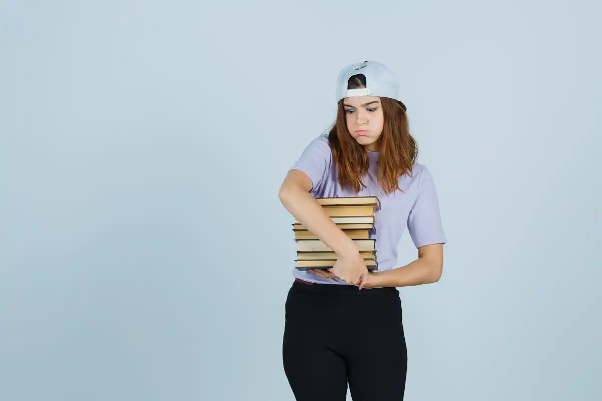 stressful dutch student in library with books