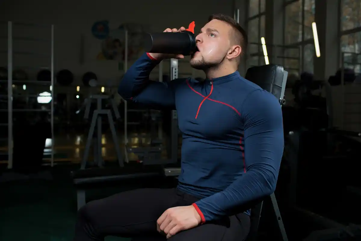 dutch man with protein shake in gym