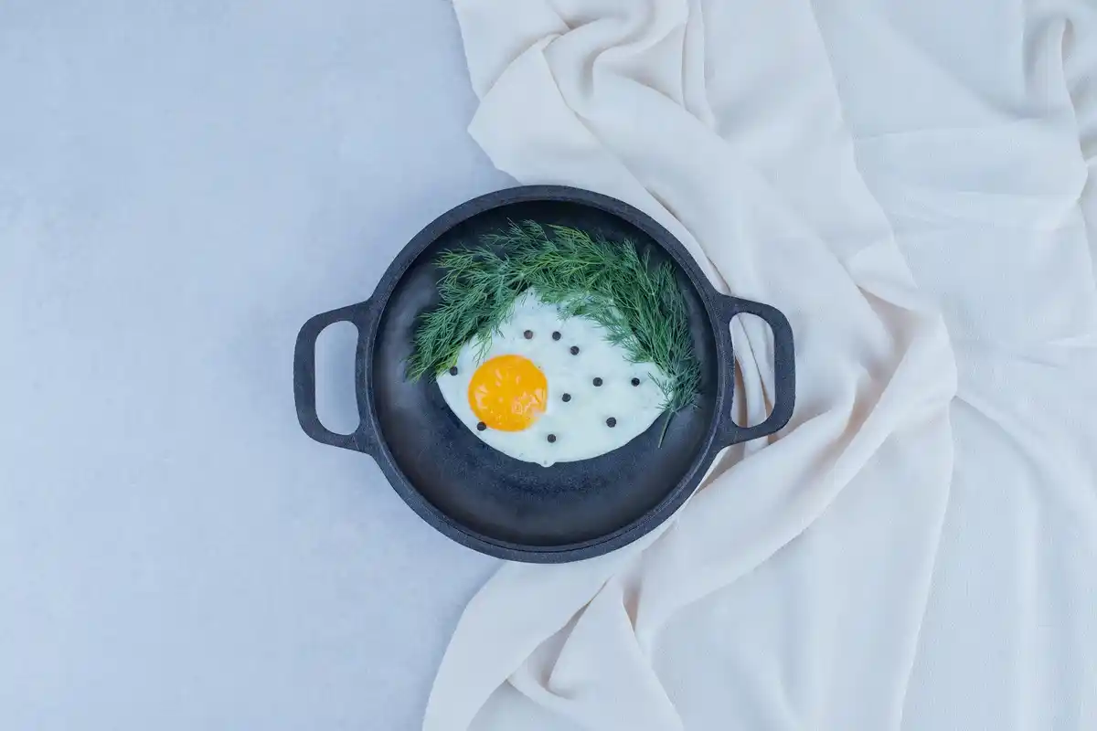 crispy fried egg in pan close up hexagon