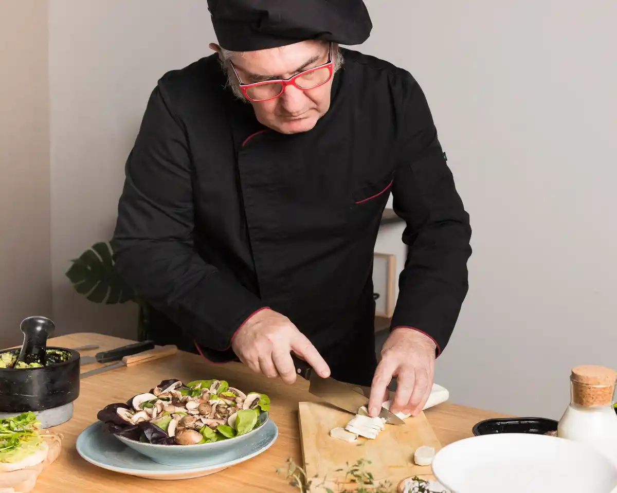 italian chef draining pasta authentic kitchen
