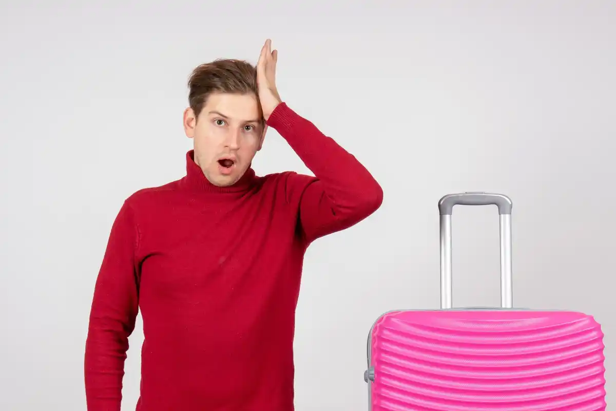 panicked traveler searching bag airport