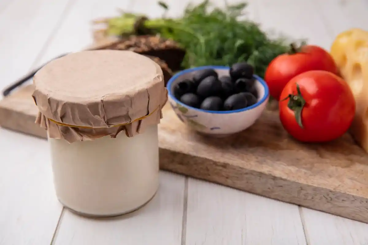 homemade garlic herb butter in small glass jar Dutch kitchen