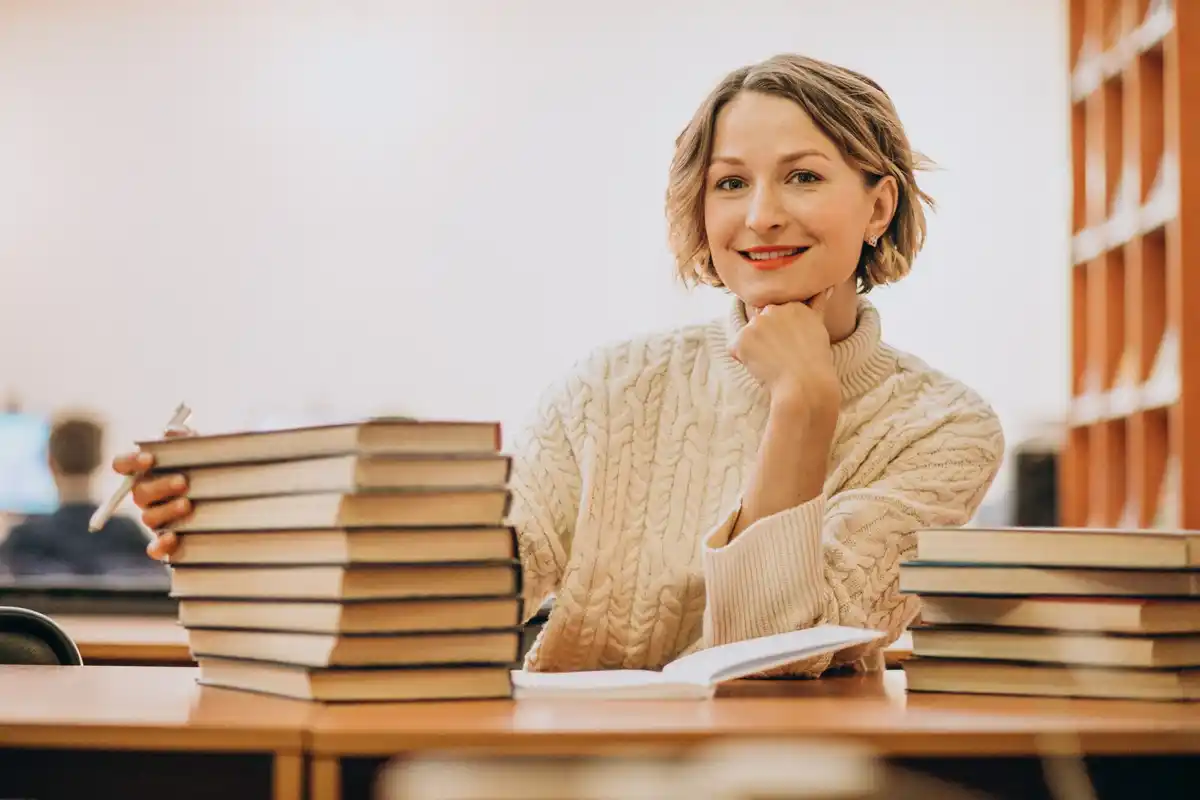 older student smiling in classroom holland university