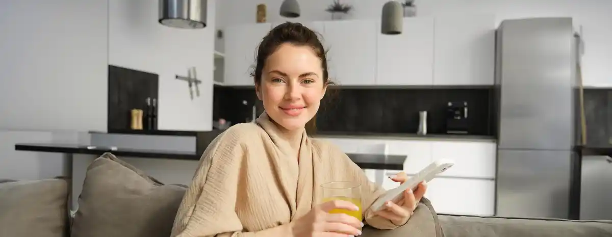 dutch woman using banking app on smartphone at home