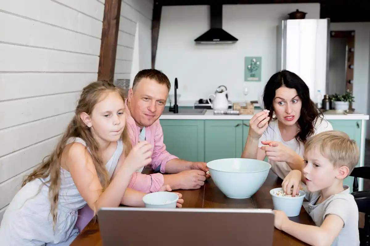 dutch family reviewing bank apps and finances at kitchen table