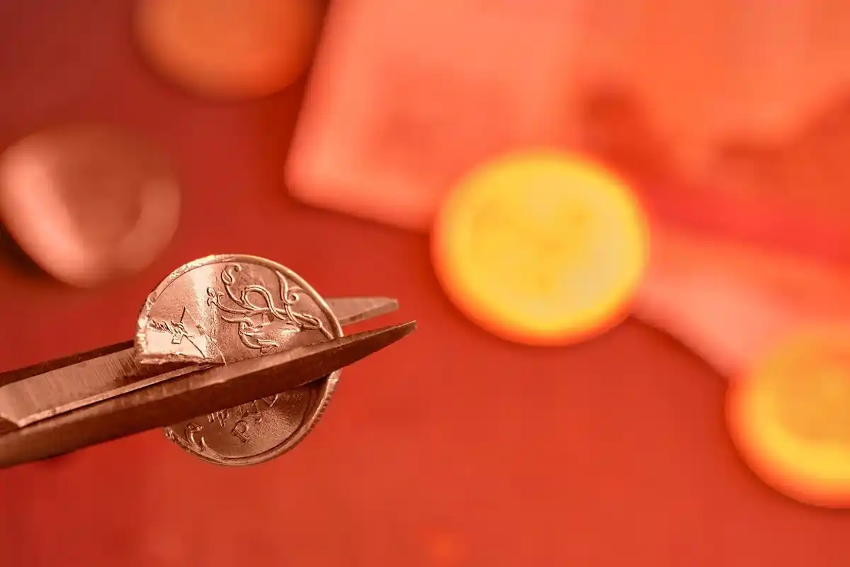 euro coins leaking from smartphone dutch concept subscription drain