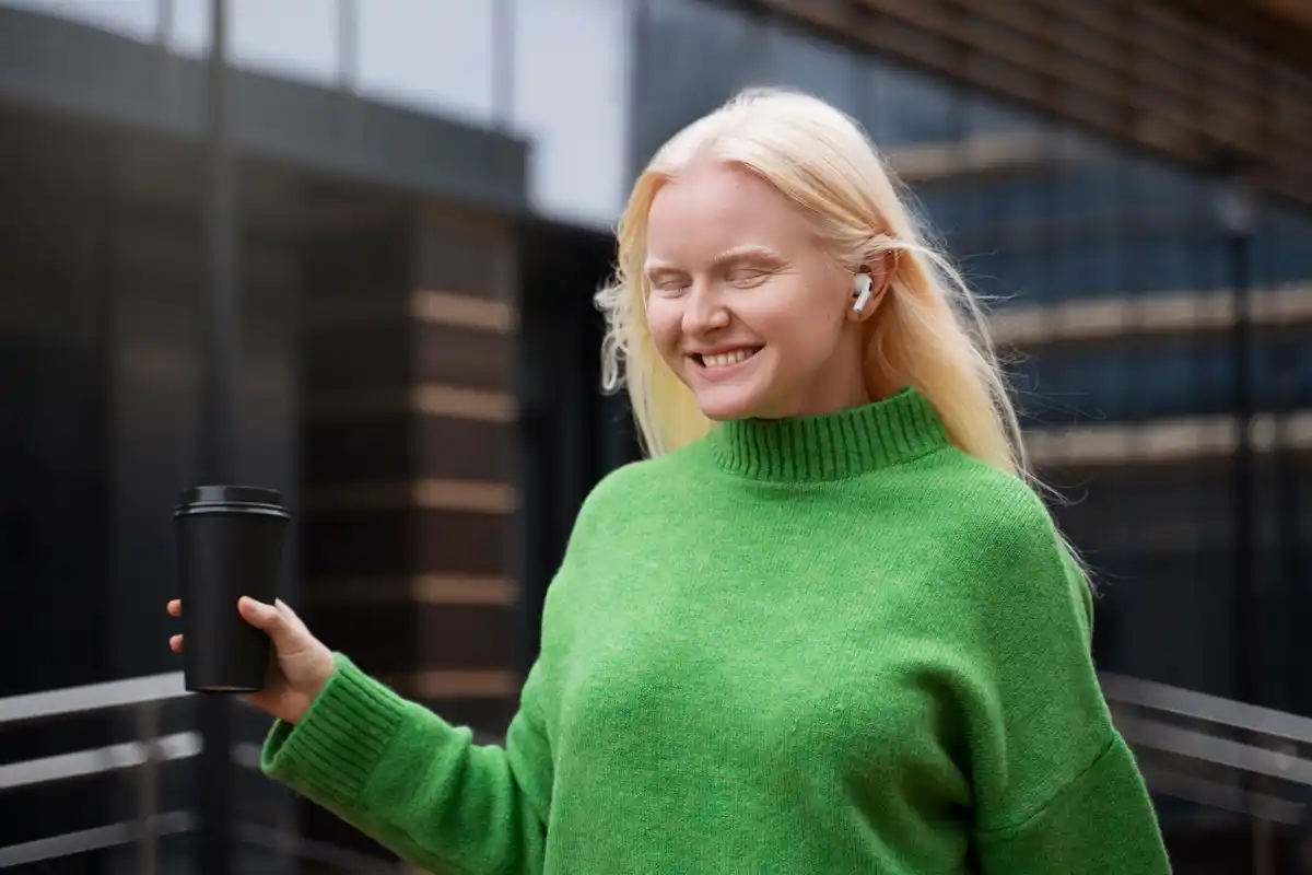 Dutch senior woman happily finding keys with bluetooth locator